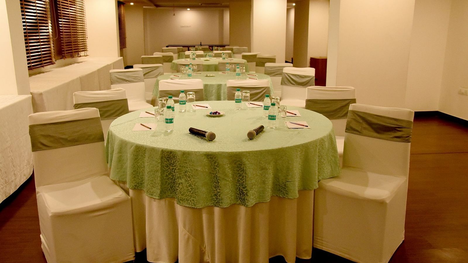 Round table seating inside the banquet hall 1 - Starlit Suites, Neemrana
