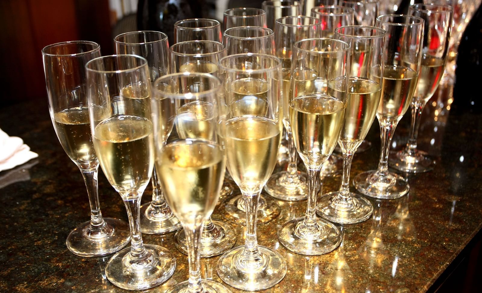 An array of sparkling champagne glasses placed on a table - Brewery Gulch Inn & Spa