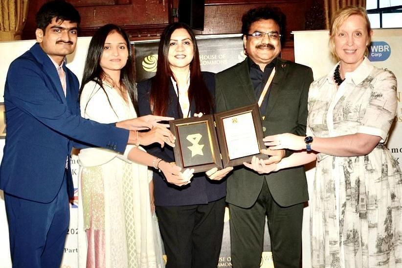 Image of the owners of the  resort receiving an award.