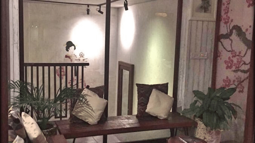 Seating space with wooden furnishings at wellness spa at Hablis Hotel, Chennai