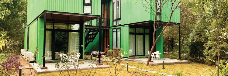 Facade view of Klub Karma Karma Kove Suite with a tree in front of it - Karma Lakelands.