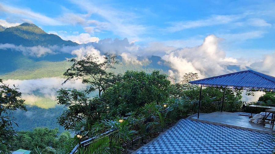 A view from a staircase that opens to mountains and lush greenery | Voyage The Royal Retreat, Gangtok
