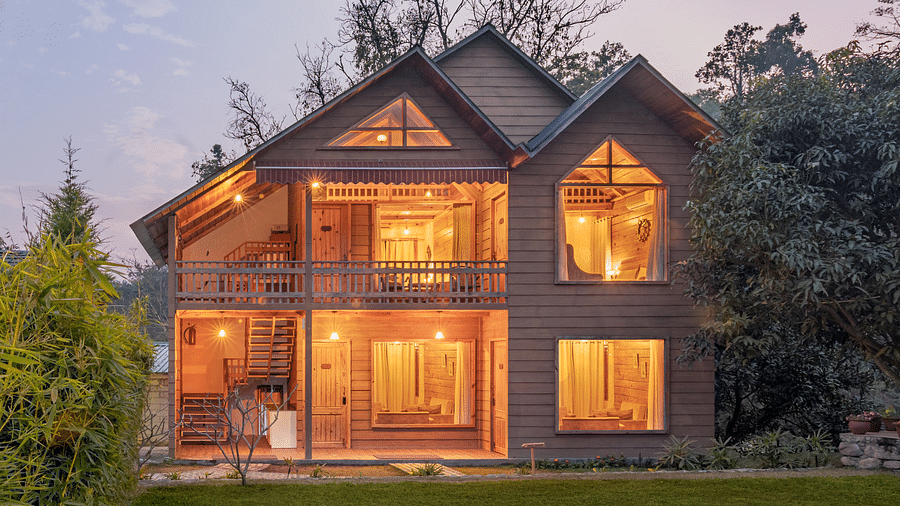 Facade view of Pinewood Cottage at dusk at the Sylvan Retreat, Dehradun.