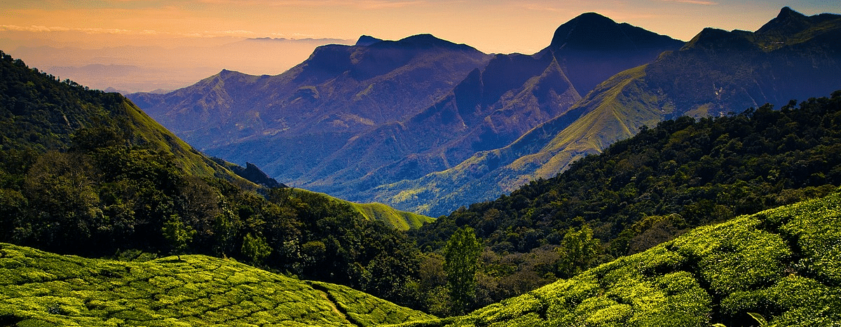 Scenic mountains with vibrant sunset colors in the background.
