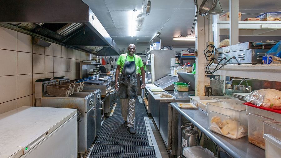 Commercial kitchen with chefs preparing food | Abaco Inn