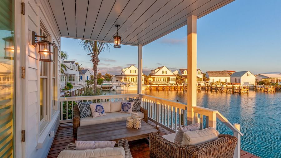 sitting area on the dock with comfortable chairs and a table offering the sea view at Abaco Inn.
