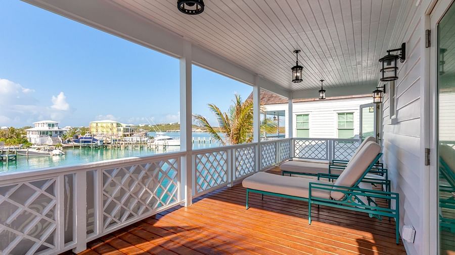 comfortable chairs on the wooden dock with the sea view at Abaco Inn.