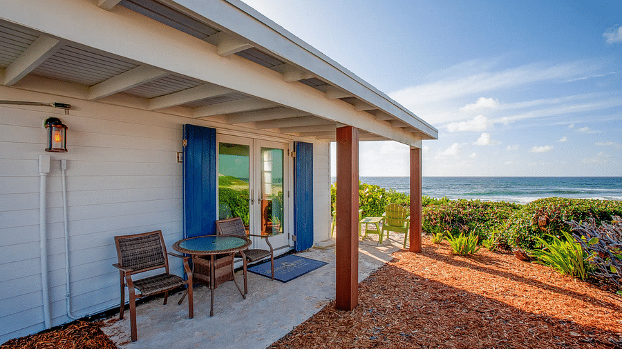Porch with chairs outside a white villa near the coast | Abaco Inn