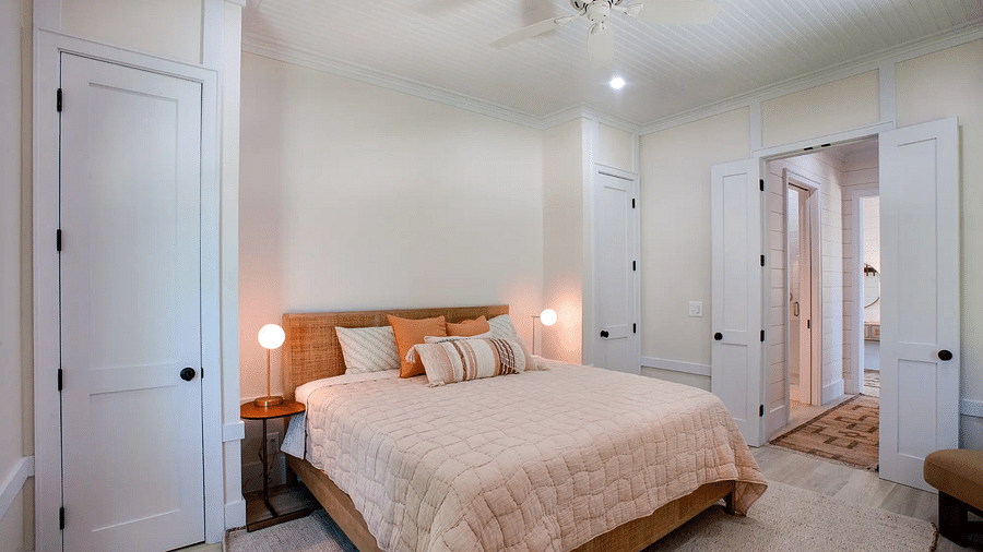 Bedroom with a double bed, bedside lamps, and a ceiling fan | Abaco Inn