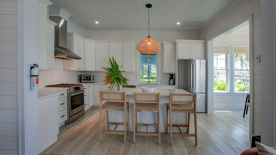 Dining area with wooden accents and a modern light fixture | Abaco Inn