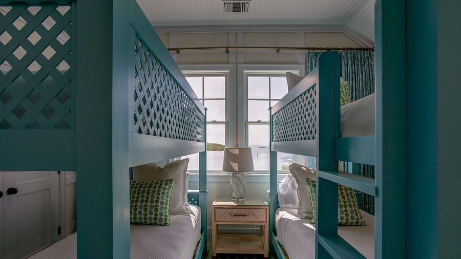 A bedroom featuring a sturdy bunk bed structure with multiple sleeping berths, designed for efficient use of space - Abaco Inn