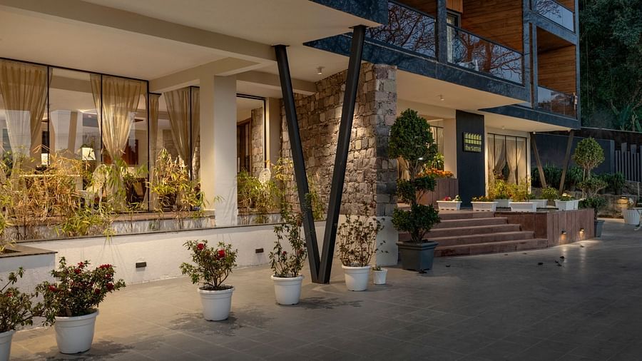 A facade image of the hotel illuminated by ambient lighting - The Samai, Bhimtal