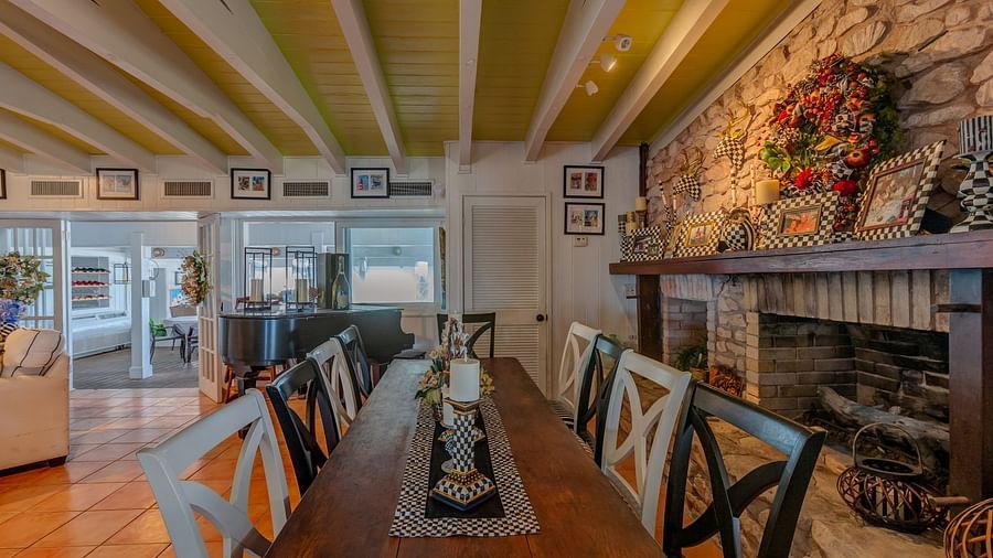 Long dining table near a fireplace | Abaco Inn