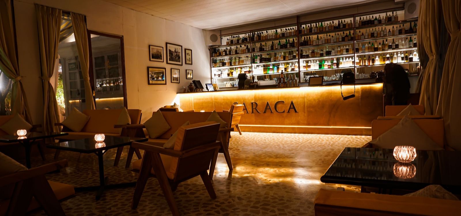 Interiors of Saraca Bar at Saraca Hotel, Lucknow with a wooden theme and a moody ambience with spot lighting
