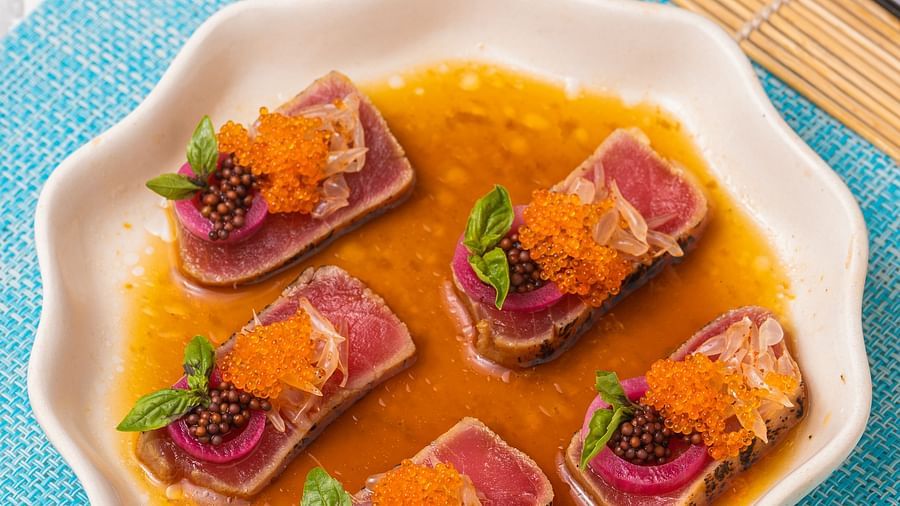 A plate of couldron served in a white china ware with a mild caramel coloured gravy.