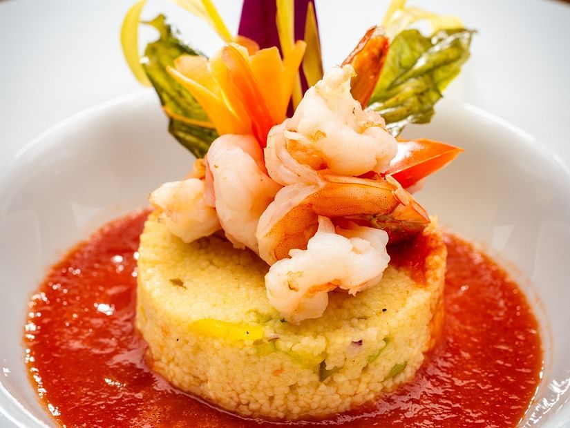 An image of a Jamaican dish made of rice and prawns served with red sauce - S Hotel Montego Bay, Jamaica