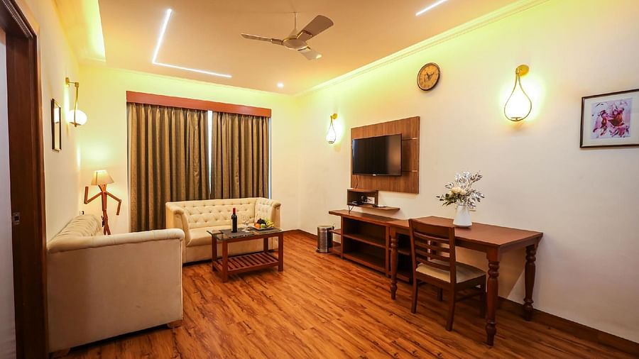 Seating area with sofas and dining table at Vagator Downtown, Goa 