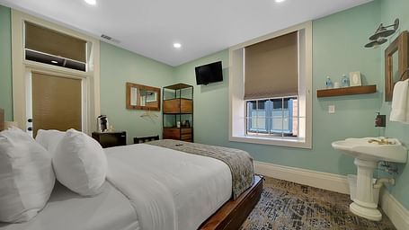 A view of a room at The Groveland Hotel with a double bed.