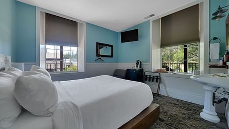 A view of a room at The Groveland Hotel with a double bed.