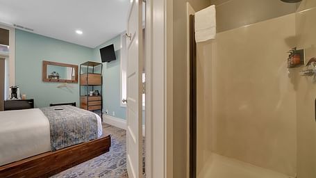 A view of a room at The Groveland Hotel with a double bed.