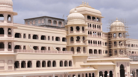 A large white palace with many arches and pillars.