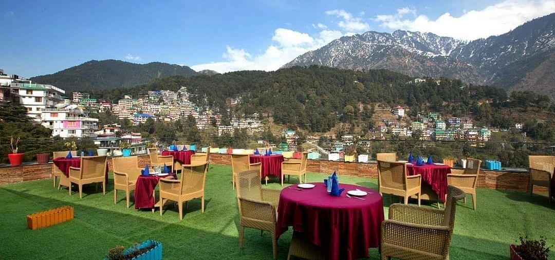 image featuring an open dining space with beautiful views of the mountain - ZENQ SIGNATURE INN, MCLEODGANJ