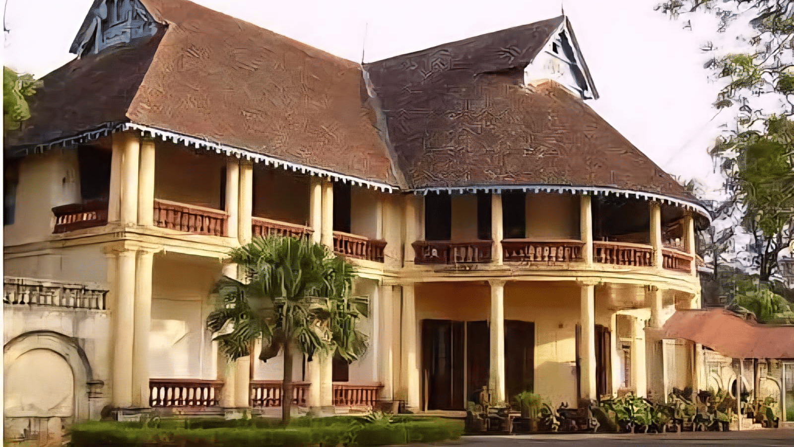 A beautiful, traditional colonial-style palace or mansion with large pillars, verandas, and a sprawling roof.