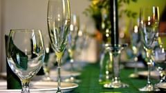 champaige glasses and plates set on a table