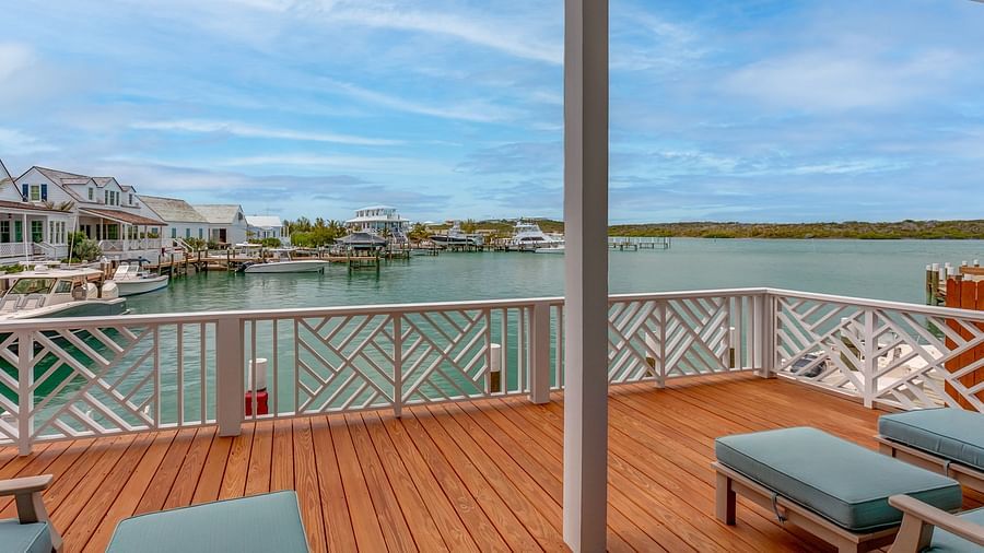 Wooden deck with seating overlooking the waterfront and scenic views | Abaco Inn
