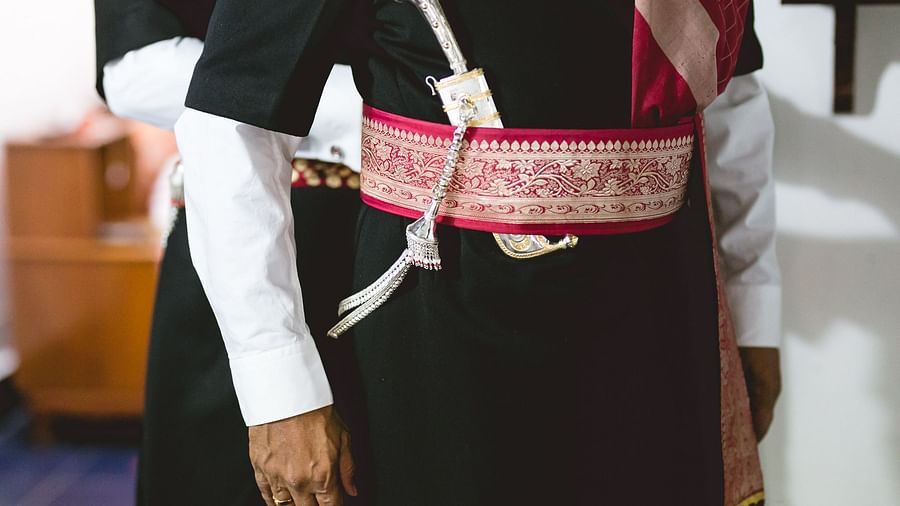 A close up shot of the traditional kodava attire at Aiyanna Lawns, Capitol Village Resort, Madikeri