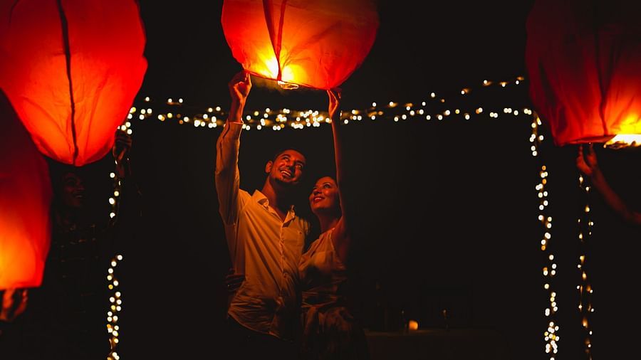 A couple posing for a picture at Aiyanna Lawns, Capitol Village Resort, Madikeri