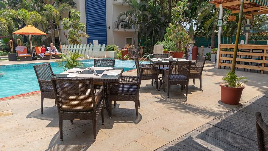 Tables by the Pool Side All Day Dining at Kyriad Prestige Calangute, Goa