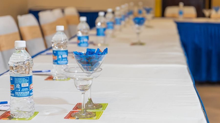 Water bottles on the tables Chairs set in a U-shaped seating at Opera Banquet Hall at Kyriad Prestige Calangute, Goa