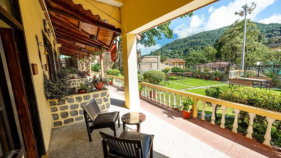 Outdoor seating with two chairs and a round table at The Pavilion, Nainital