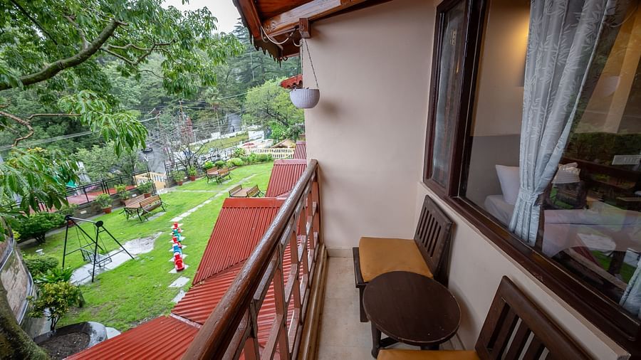 Balcony with chairs and view at The Pavilion, Nainital