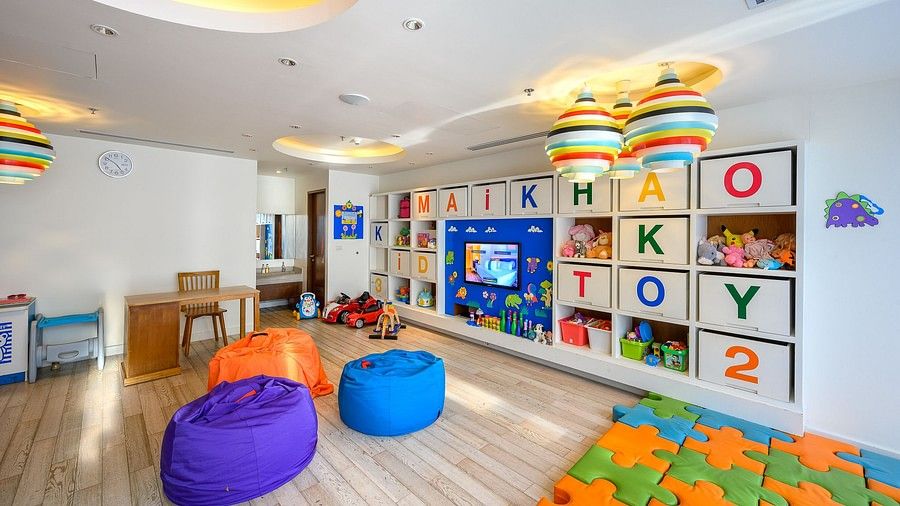 image of the kids club with bean bags in the middle and a puzzle mat - Maikhao Dream Villa Resort & Spa, Phuket