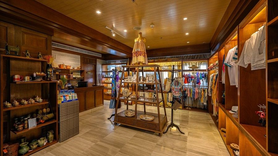 image of the souvenir shop with various clothes and gift articles for display - Maikhao Dream Villa Resort & Spa, Phuket