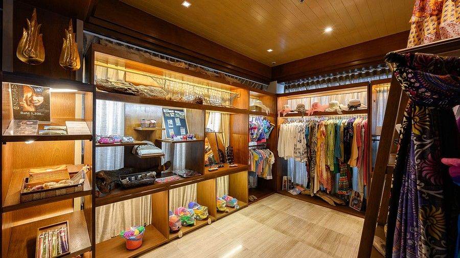 corner view image of the souvenir shop with a lot of clothes hanging - Maikhao Dream Villa Resort & Spa, Phuket