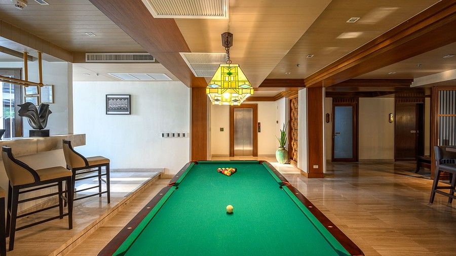 image of the business centre featuring an expansive pool table at maikhao dream villa resort and spa, phuket