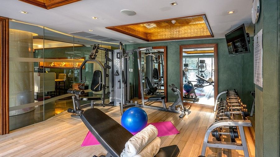 corner view image of the fitness centre with a pink yoga mat in the centre of the room - Maikhao Dream Villa Resort & Spa, Phuket