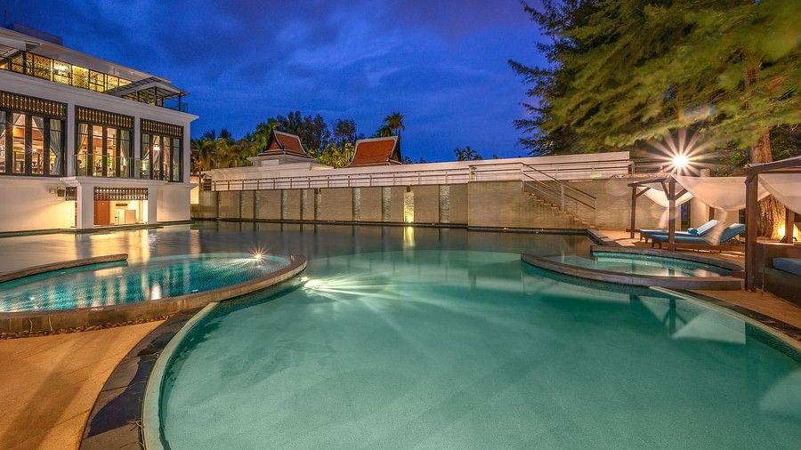 image of the swimming pool on a late evening with pretty blue sky in the background - Maikhao Dream Villa Resort & Spa, Phuket