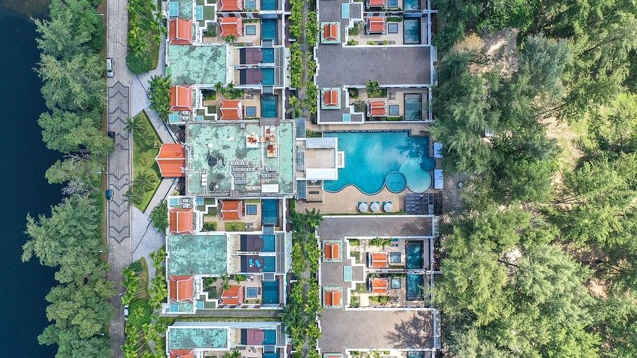 top view image of maikhao dream villa resort and spa showcasing a common swimming pool in phuket