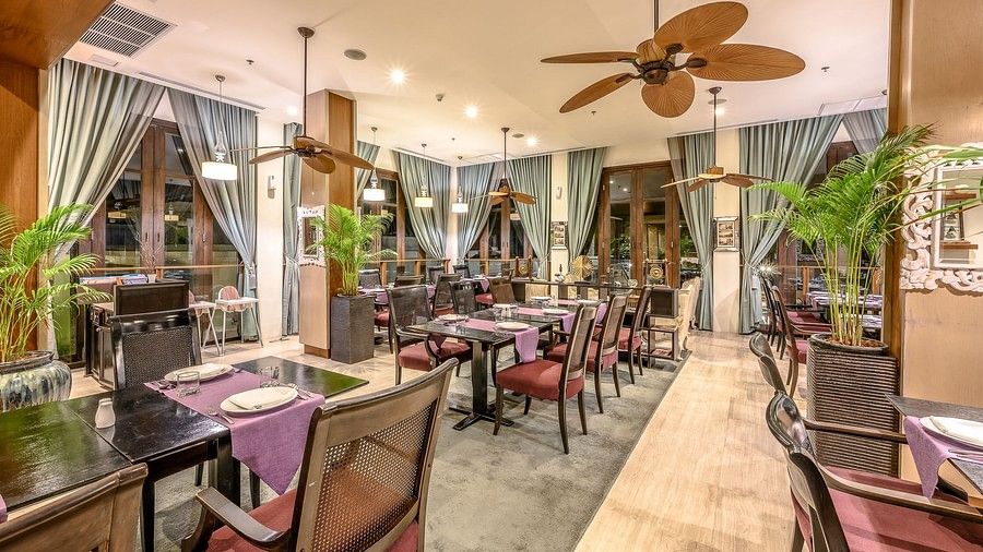 image of a cosy indoor dining area with well arranged seating arrangements - Maikhao Dream Villa Resort & Spa, Phuket