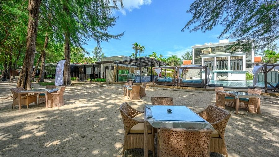 image featuring a dining table with a glass top surrounded by four chairs - Maikhao Dream Villa Resort & Spa, Phuket