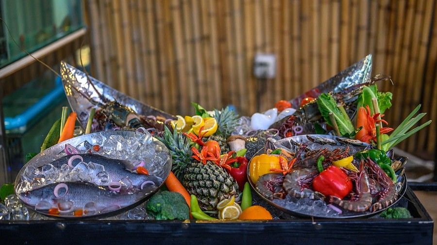 image of a seafood platter with a variety of aquatic life in the plates - Maikhao Dream Villa Resort & Spa, Phuket