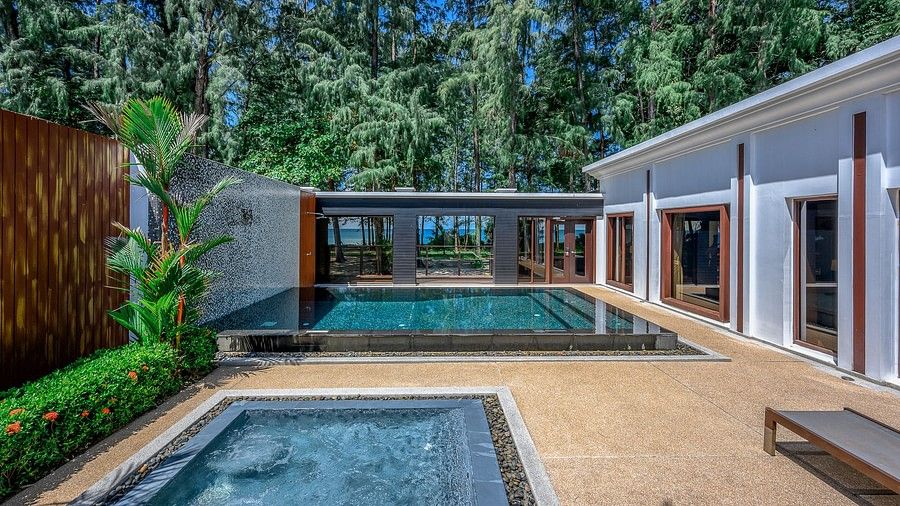 image of two swimming pools in the one bedroom private pool beachfront villa