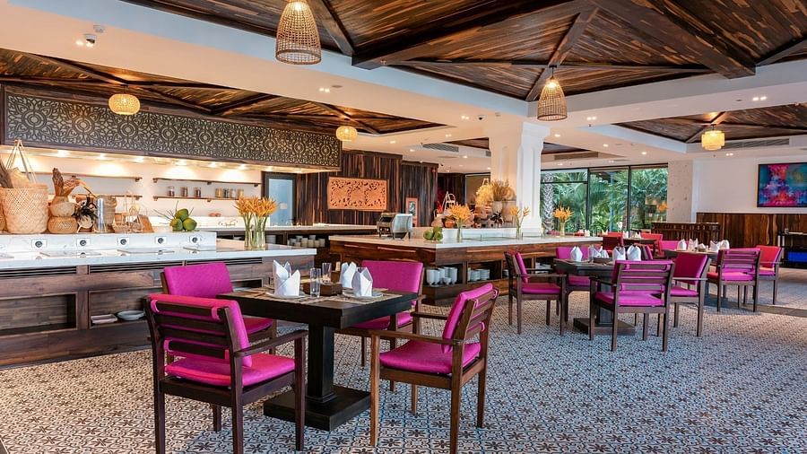 A big hall with table and four chairs for each - Alibu Resorts Nha Trang