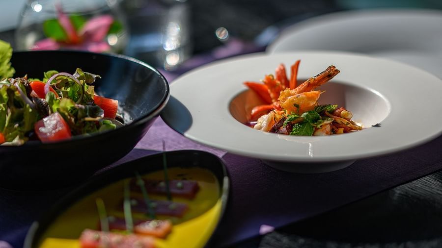 A close-up shot of exotic food served with beautifully cut vegetable julienne and a saucy meat dish – Maikhao Dream Villa Resort & Spa, Phuket.