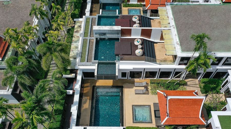 a bird eye view image showcasing the villas and the attached swimming pools