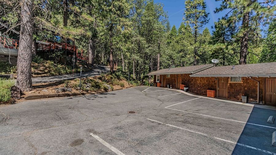 Outdoor parking area at Narrow Gauge Inn during the day.